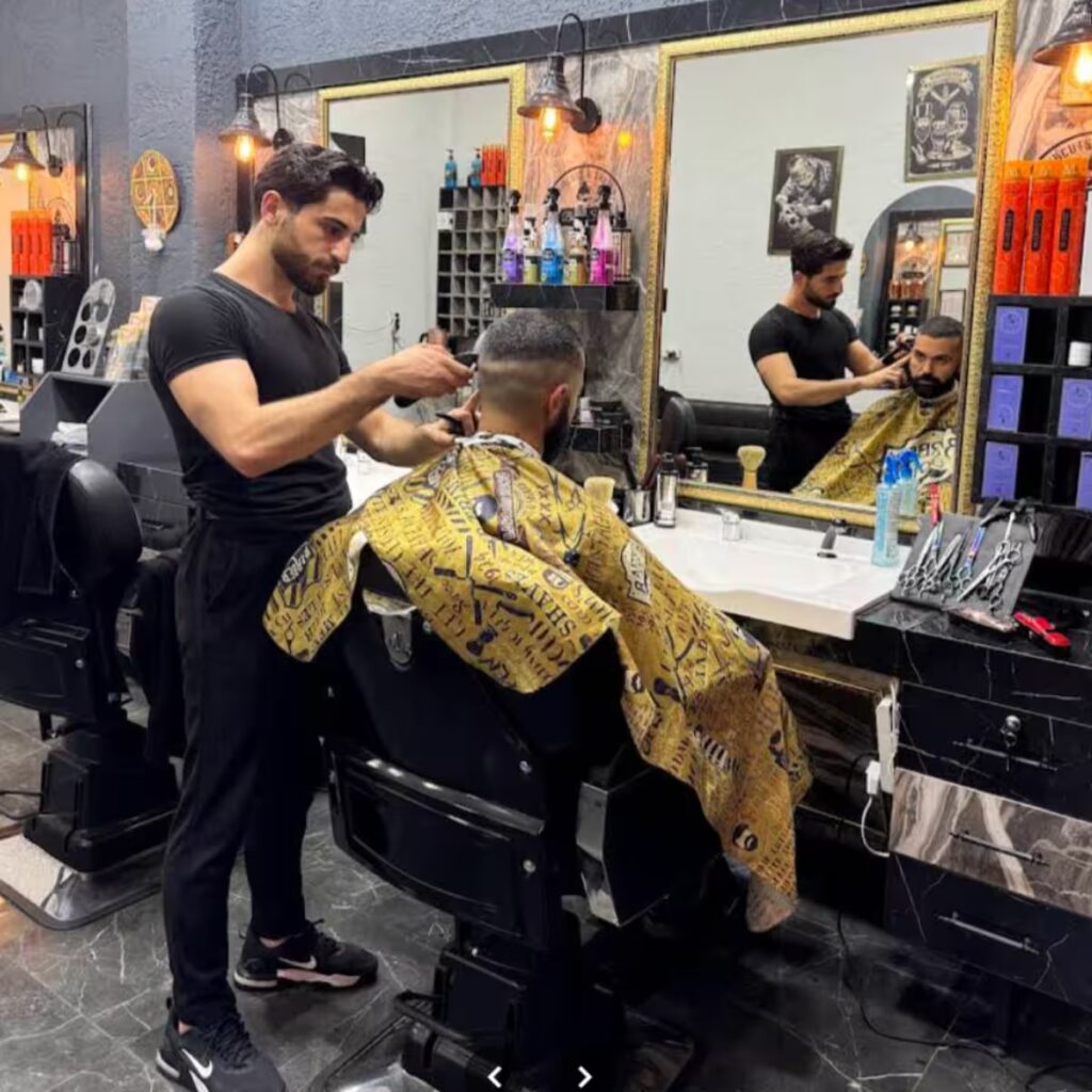 Barber cutting a customer's hair at Fade Barber Taksim